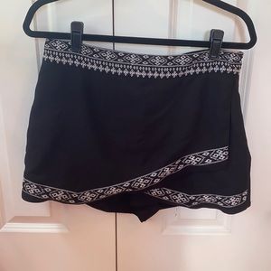 Black skort with white embroidered trim